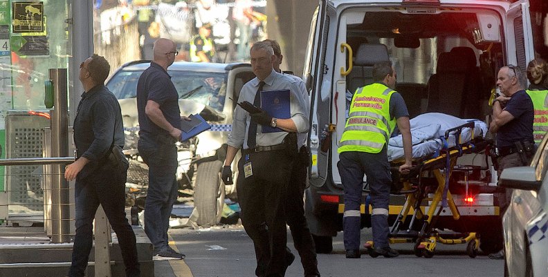 Australian police and paramedics are seen near the place where they arrested the driver of a vehicle that had ploughed into pedestrians at a crowded intersection near the Flinders Street train station, in central Melbourne Australian police and paramedics are seen near the place where they arrested the driver of a vehicle that had ploughed into pedestrians at a crowded intersection near the Flinders Street train station, in central Melbourne