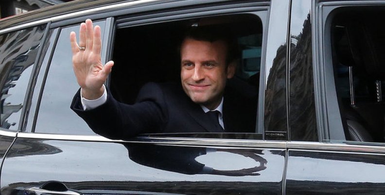 Emmanuel Macron, head of the political movement En Marche !, or Onwards !, and candidate for the 2017 presidential election, waves from his car as he leaves his home during the second round of the election, in Paris Emmanuel Macron, head of the political movement En Marche !, or Onwards !, and candidate for the 2017 presidential election, waves from his car as he leaves his home during the second round of the election, in Paris