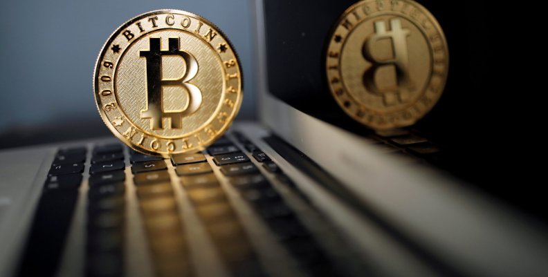 FILE PHOTO: A Bitcoin (virtual currency) coin is seen in an illustration picture taken at La Maison du Bitcoin in Paris FILE PHOTO: A Bitcoin (virtual currency) coin is seen in an illustration picture taken at La Maison du Bitcoin in Paris