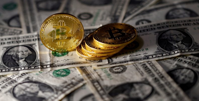 FILE PHOTO: Bitcoin (virtual currency) coins placed on Dollar banknotes are seen in this illustration picture FILE PHOTO: Bitcoin (virtual currency) coins placed on Dollar banknotes are seen in this illustration picture