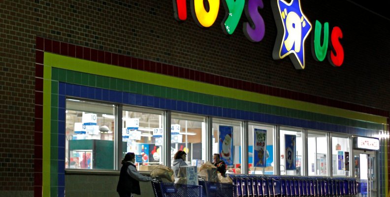 FILE PHOTO: Consumers leave a Toys R Us store with full shopping carts after shopping on the day dubbed "Black Friday" in Framingham FILE PHOTO: Consumers leave a Toys R Us store with full shopping carts after shopping on the day dubbed "Black Friday" in Framingham