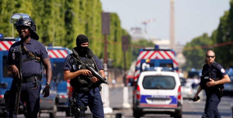French policemen secure the area on the Champs Elysees avenue after an incident in Paris French policemen secure the area on the Champs Elysees avenue after an incident in Paris