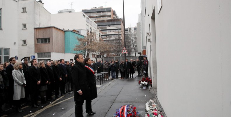 French President Emmanuel Macron and Paris mayor Anne Hidalgo observe a minute of silence outside the satirical newspaper Charlie Hebdo former office in Paris French President Emmanuel Macron and Paris mayor Anne Hidalgo observe a minute of silence outside the satirical newspaper Charlie Hebdo former office in Paris