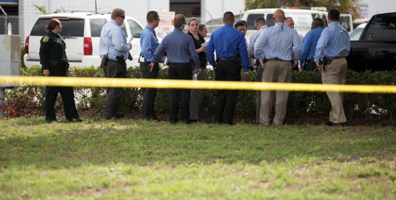 Investigators work the scene of a fatal workplace shooting in Orlando, Florida, U.S. Investigators work the scene of a fatal workplace shooting in Orlando, Florida, U.S.