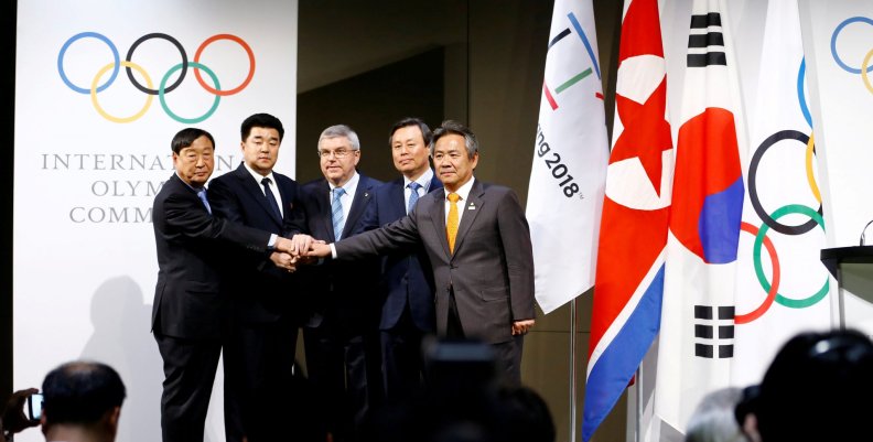 IOC President Thomas Bach poses with the National Olympic Committee of the Republic of Korea and the NOC of the Democratic People’s Republic of Korea, at the Olympic Museum in Lausanne IOC President Thomas Bach poses with the National Olympic Committee of the Republic of Korea and the NOC of the Democratic People’s Republic of Korea, at the Olympic Museum in Lausanne