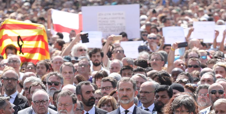 King Felipe of Spain sits between Prime Minister Mariano Rajoy and President of the Generalitat of Catalonia Carles Puigdemont as they observe a minute of silence in Placa de Catalunya in Barcelona King Felipe of Spain sits between Prime Minister Mariano Rajoy and President of the Generalitat of Catalonia Carles Puigdemont as they observe a minute of silence in Placa de Catalunya in Barcelona