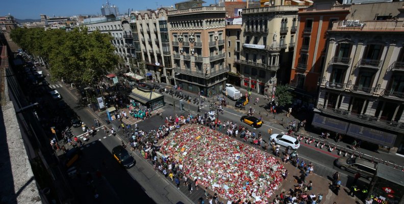 People gather at an impromptu memorial where a van crashed into pedestrians at Las Ramblas in Barcelona People gather at an impromptu memorial where a van crashed into pedestrians at Las Ramblas in Barcelona
