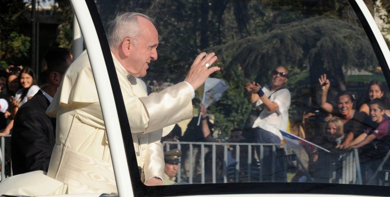 Pope Francis waves while driving through Santiago Pope Francis waves while driving through Santiago