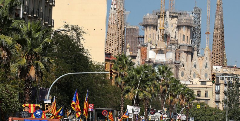 Tractors drive near the Sagrada Familia cathedral during a protest in favour of the banned referendum on independence from Spain in Barcelona Tractors drive near the Sagrada Familia cathedral during a protest in favour of the banned referendum on independence from Spain in Barcelona
