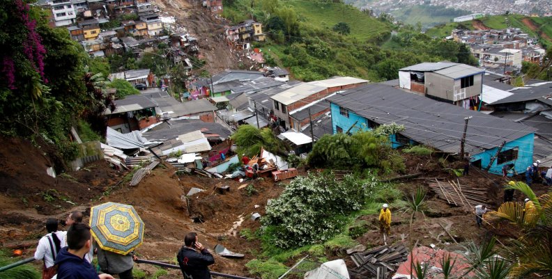 View of a neighborhood destroyed after mudslides, caused by heavy rains leading several rivers to overflow, pushing sediment and rocks into buildings and roads, in Manizales View of a neighborhood destroyed after mudslides, caused by heavy rains leading several rivers to overflow, pushing sediment and rocks into buildings and roads, in Manizales