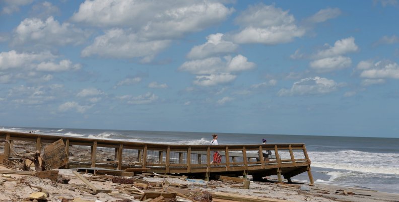 Women walk on a damaged beach access ramp after Hurricane Irma passed the area in Ponte Vedra Beach Women walk on a damaged beach access ramp after Hurricane Irma passed the area in Ponte Vedra Beach
