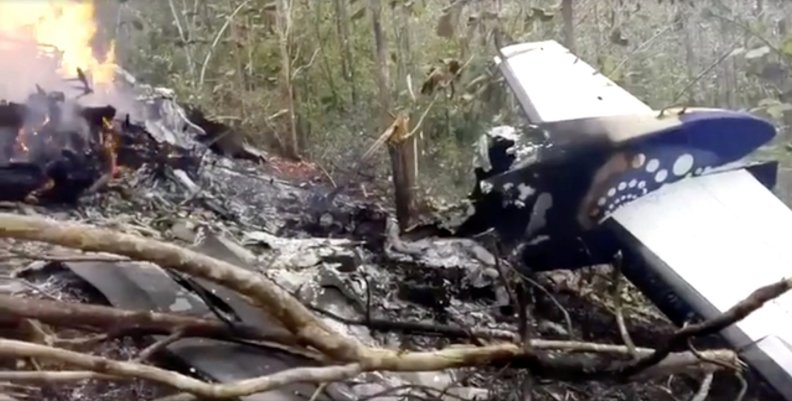 Wreckage in flames after a plane crashed in the mountainous area of Punta Islita, in the province of Guanacaste, in Costa Rica Wreckage in flames after a plane crashed in the mountainous area of Punta Islita, in the province of Guanacaste, in Costa Rica
