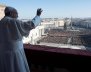 Pope Francis waves as he leads the "Urbi et Orbi" (to the city and the world) message from the balcony overlooking St. Peter's Square at the Vatican
