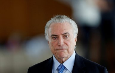 FILE PHOTO: Brazil's President Michel Temer reacts during breakfast with journalists at the Alvorada Palace in Brasilia