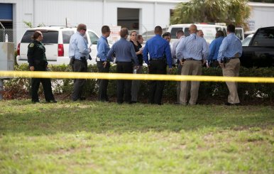 Investigators work the scene of a fatal workplace shooting in Orlando, Florida, U.S.