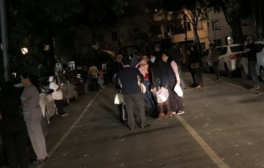 People gather on a street after an earthquake hit Mexico City